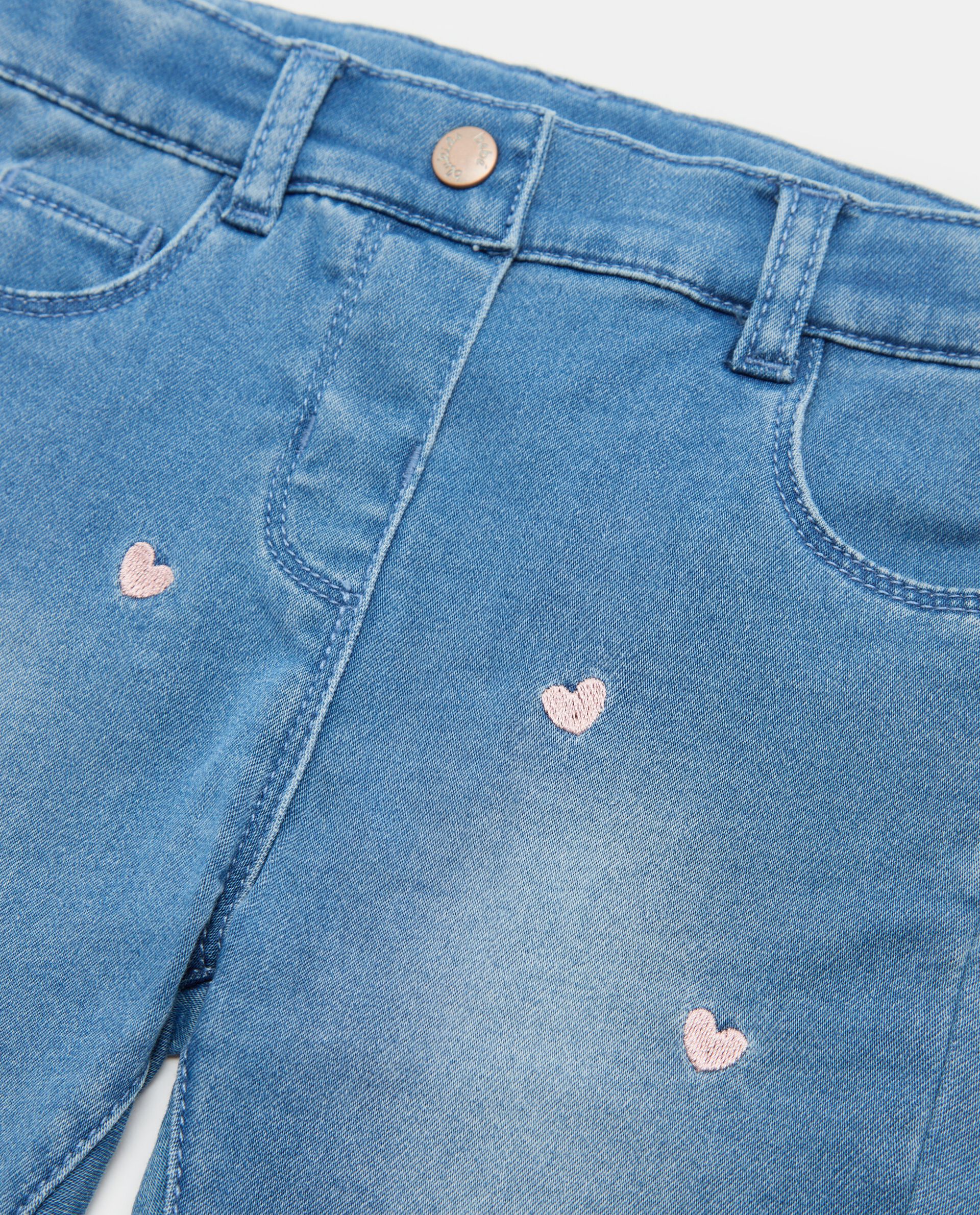 Jeans con ricami in cotone elasticizzato neonata