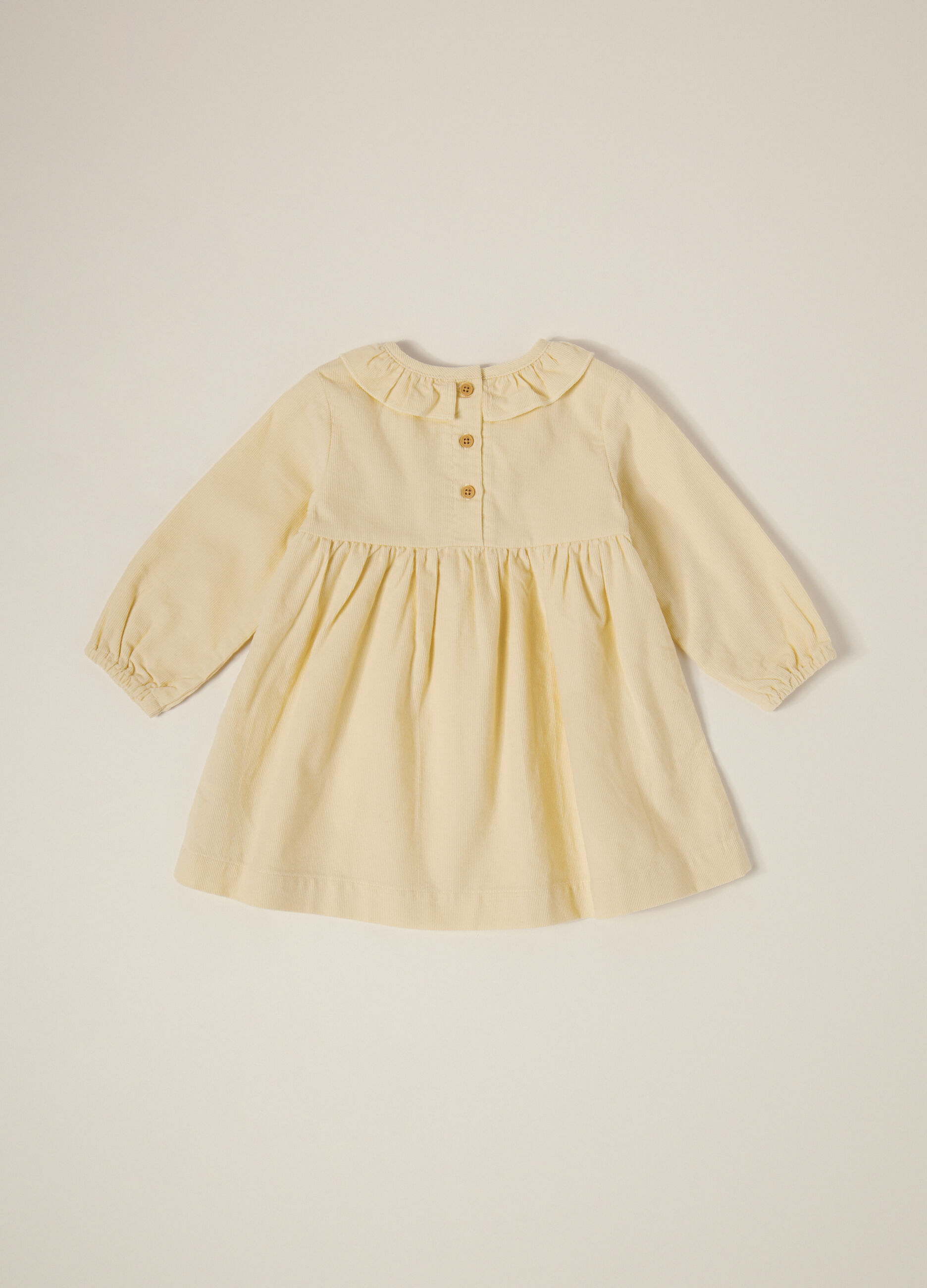 Abito beige in velluto a coste con ricami floreali_1