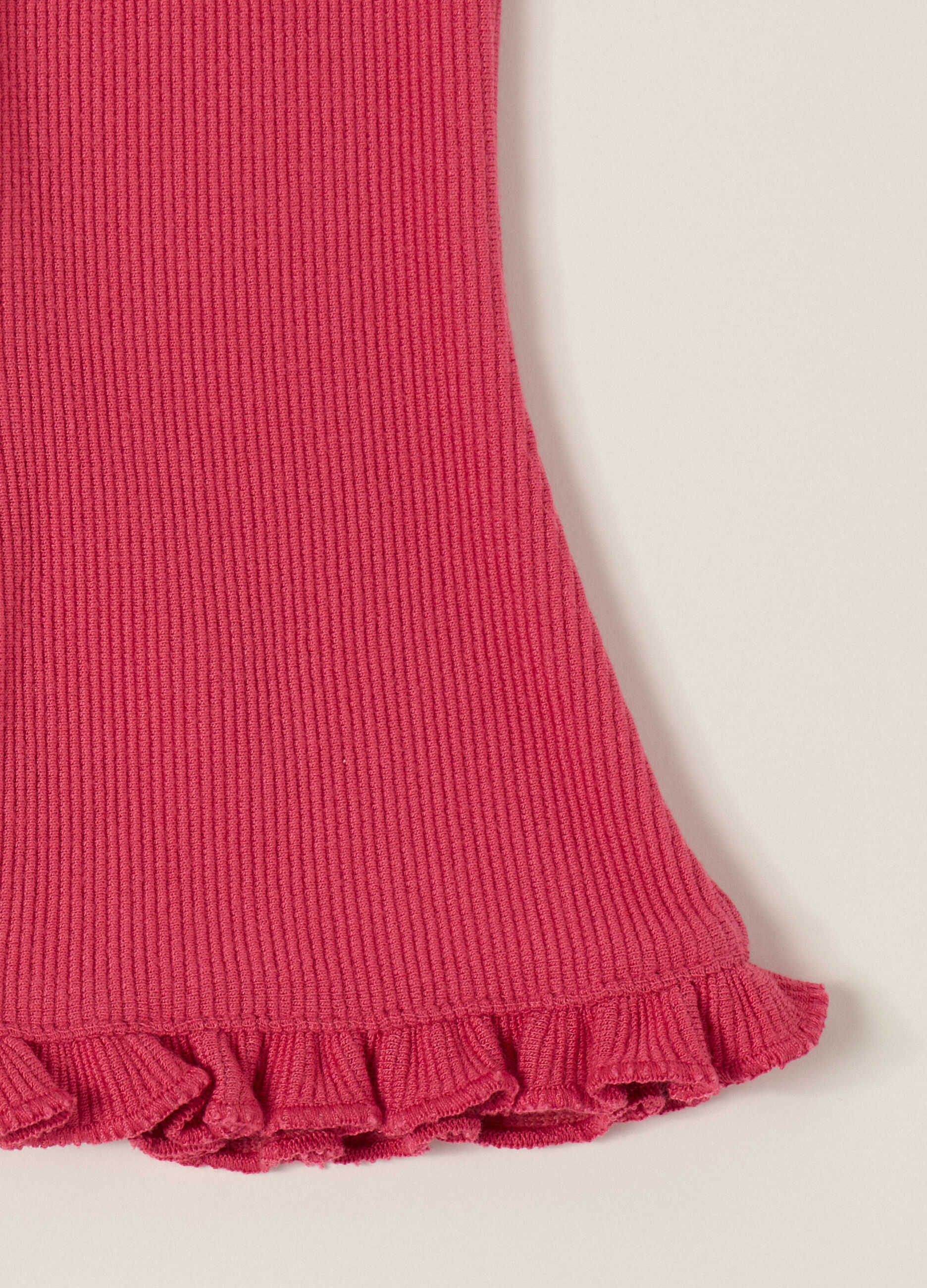 Pantaloni rosa elasticizzati con volant