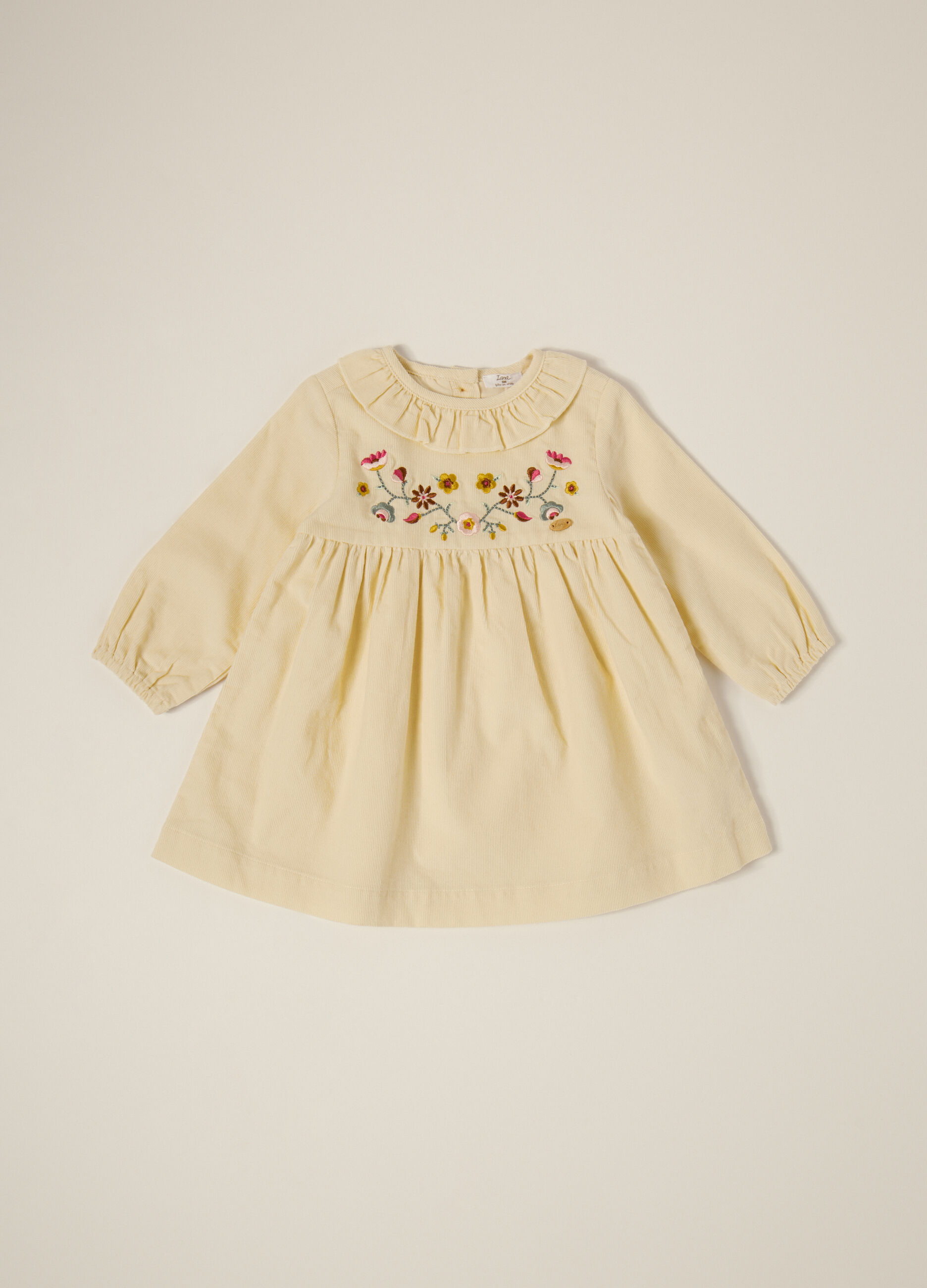 Abito beige in velluto a coste con ricami floreali_0