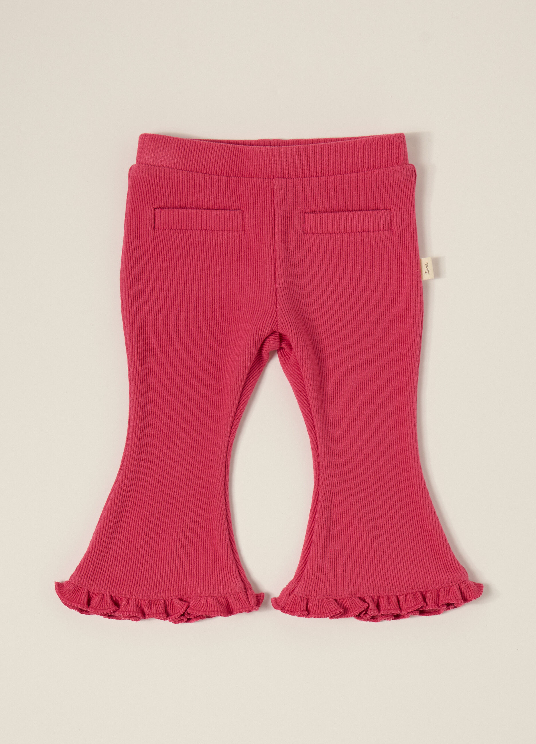 Pantaloni rosa elasticizzati con volant
