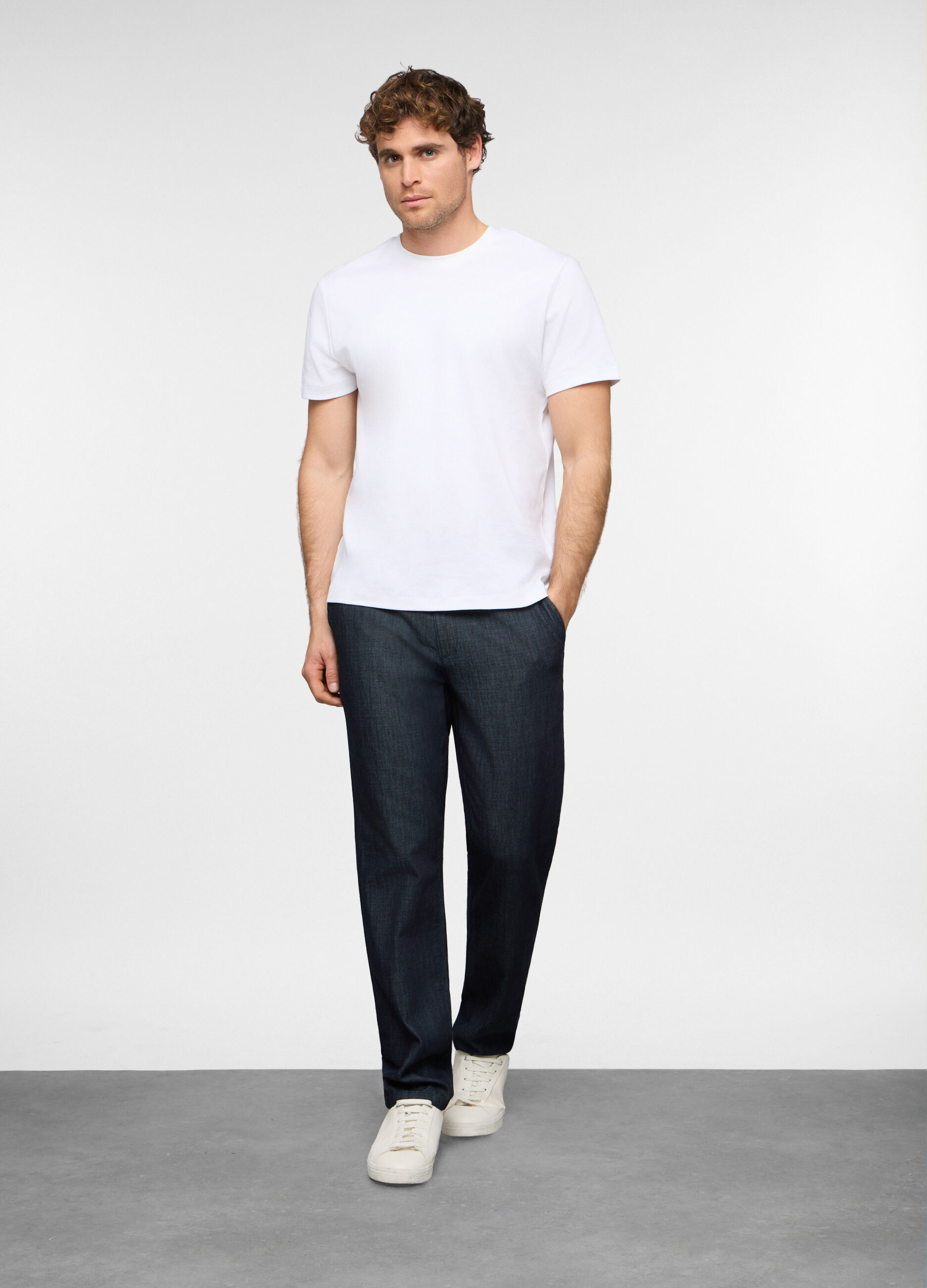 Jeans slim fit in denim di cotone e viscosa uomo_0