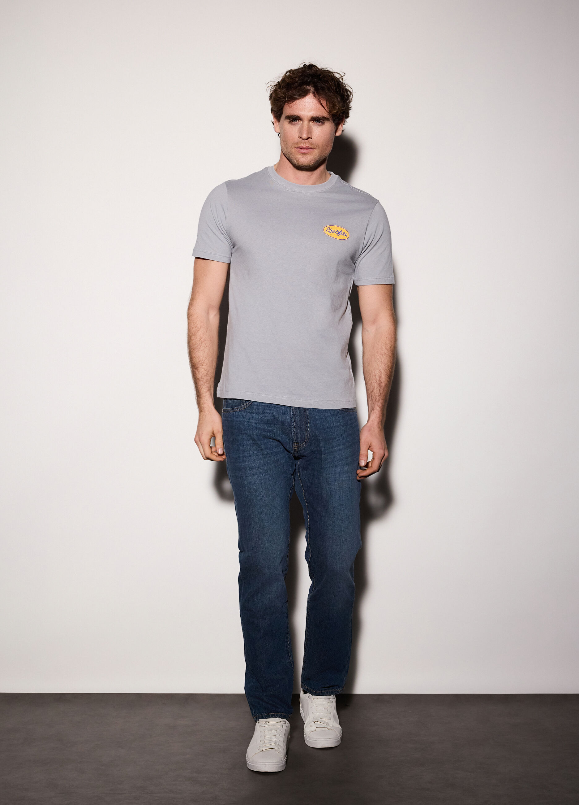 Jeans regular fit in denim di cotone uomo_0