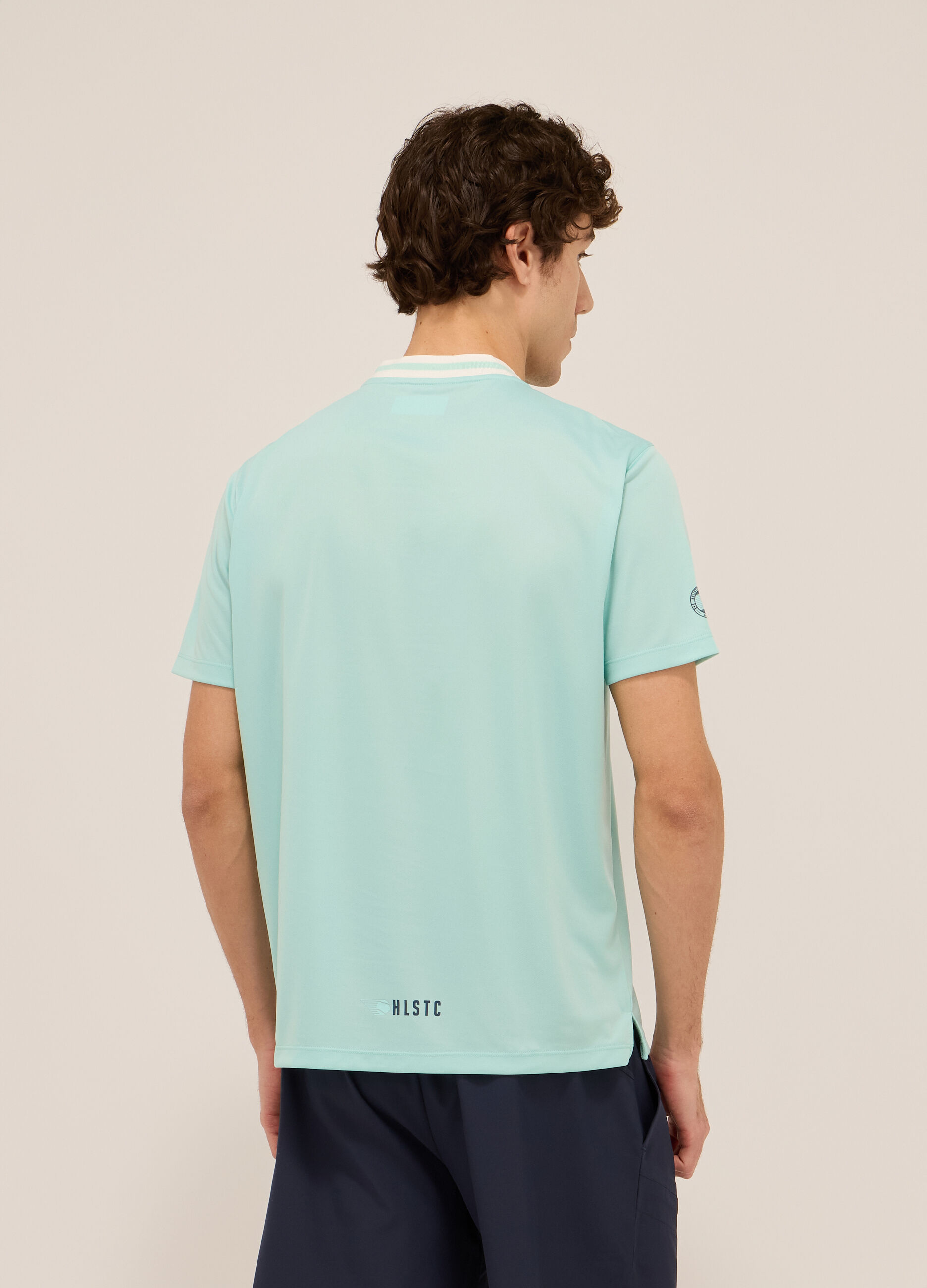 Polo sportiva con colletto coreano in jersey di tessuto tecnico uomo