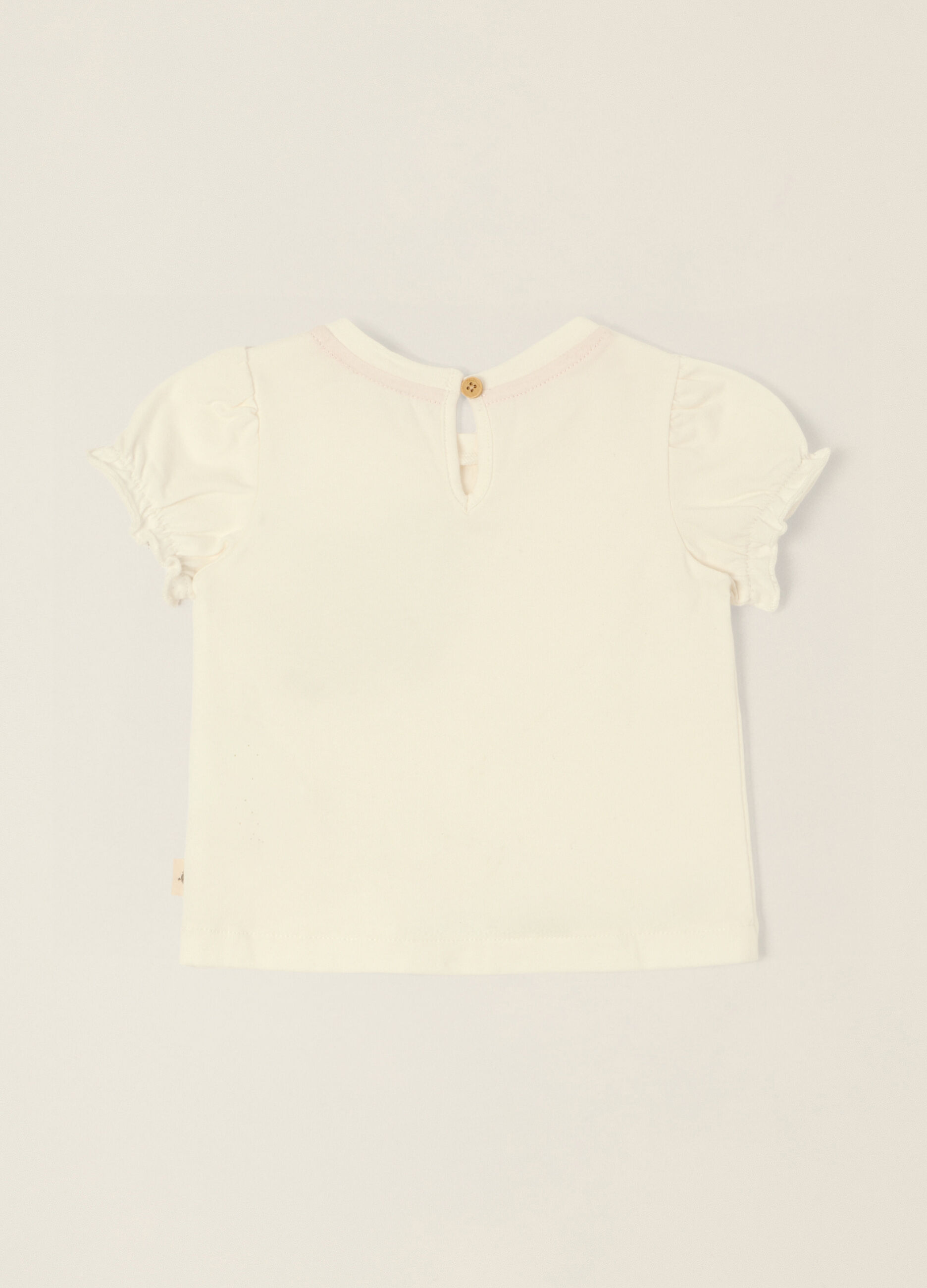 T-shirt bianca in cotone elasticizzato con applicazione cuoricino_1