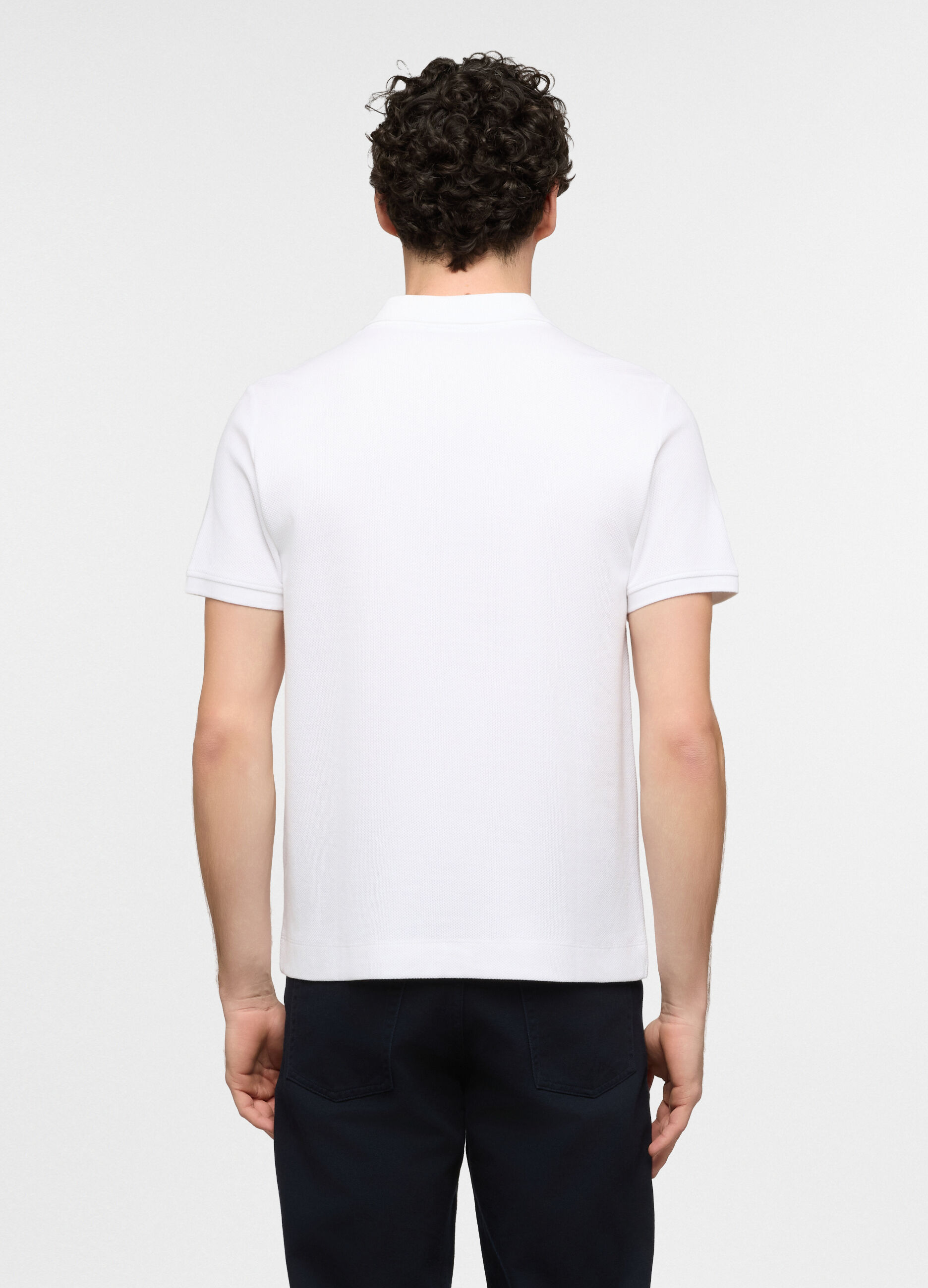 Polo a maniche corte in cotone con allacciatura seminascosta uomo_1