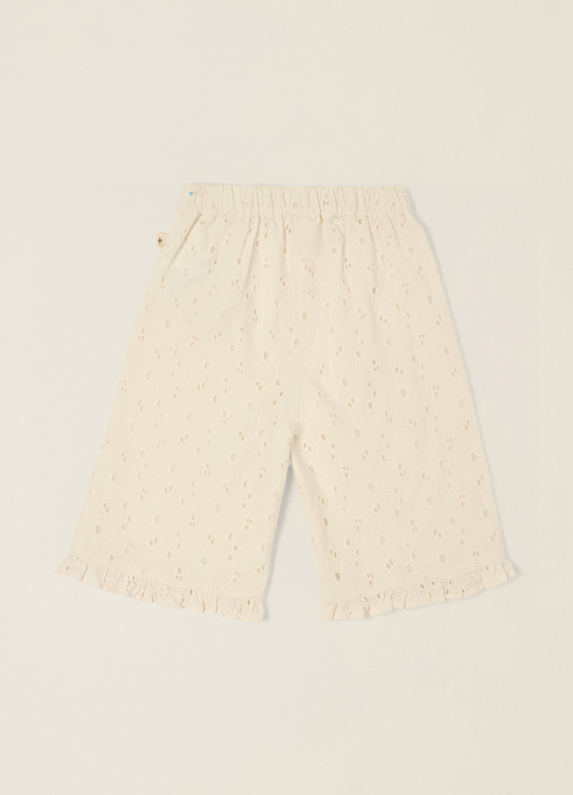 Pantaloni beige in puro cotone con texture traforata_1