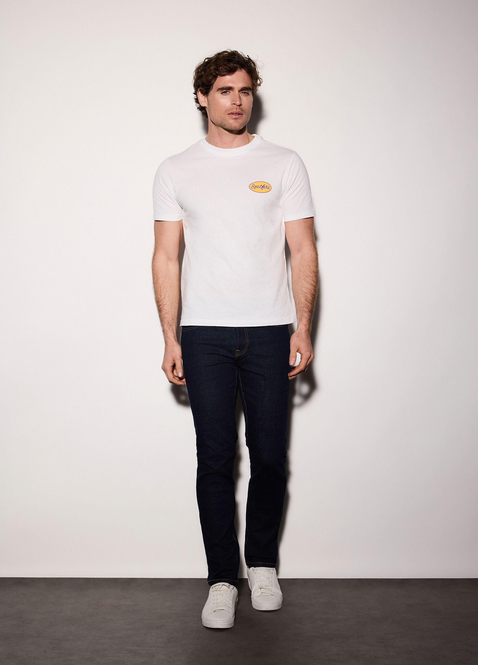 Jeans slim fit in denim di cotone elasticizzato uomo_0