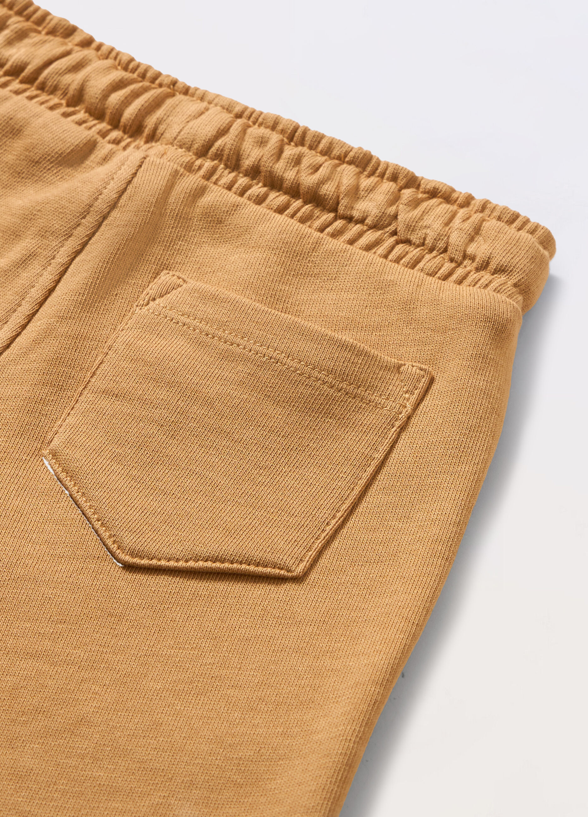 Jogger in french terry di puro cotone neonato_1