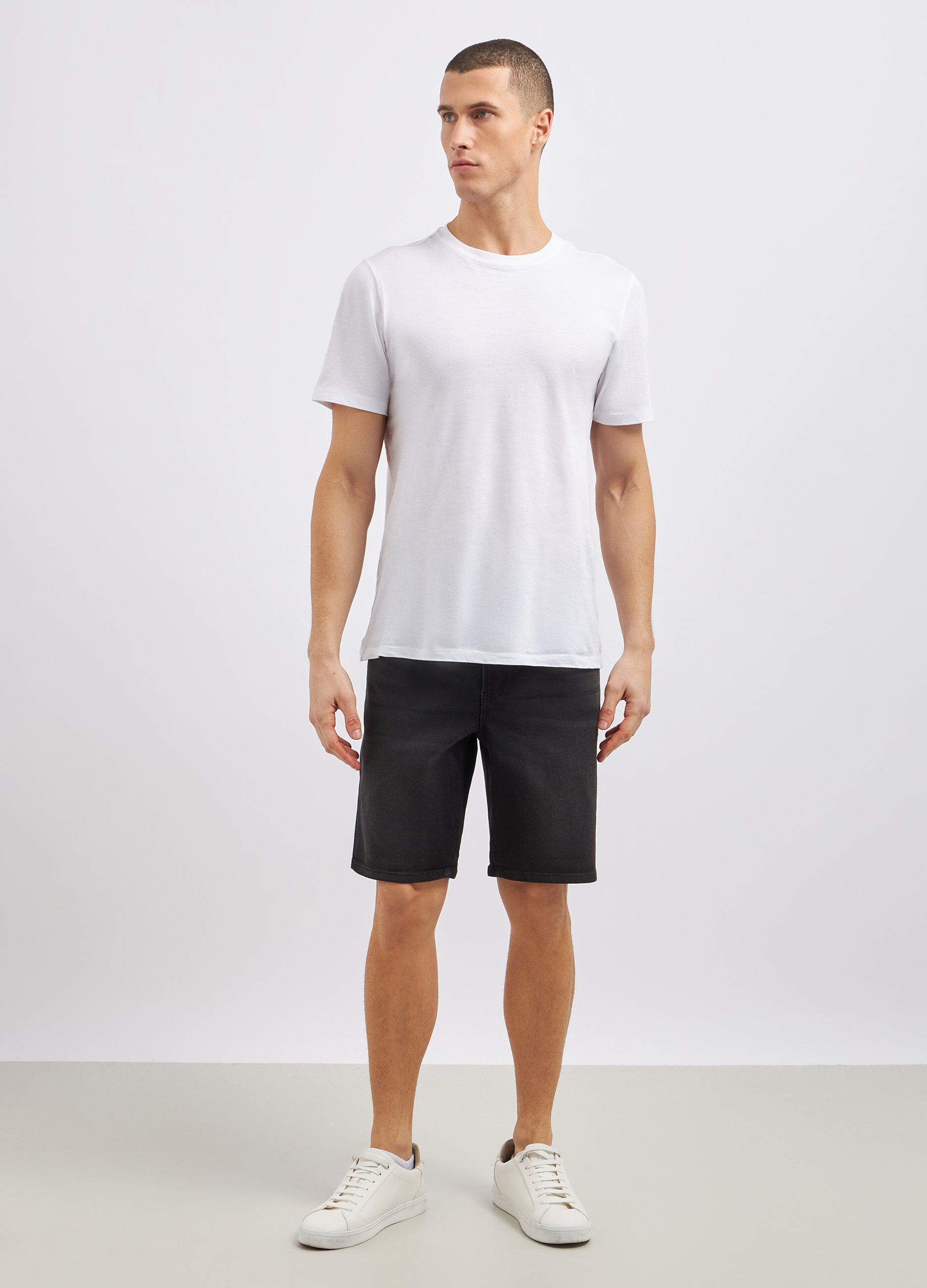Shorts in denim di misto cotone stretch uomo_0