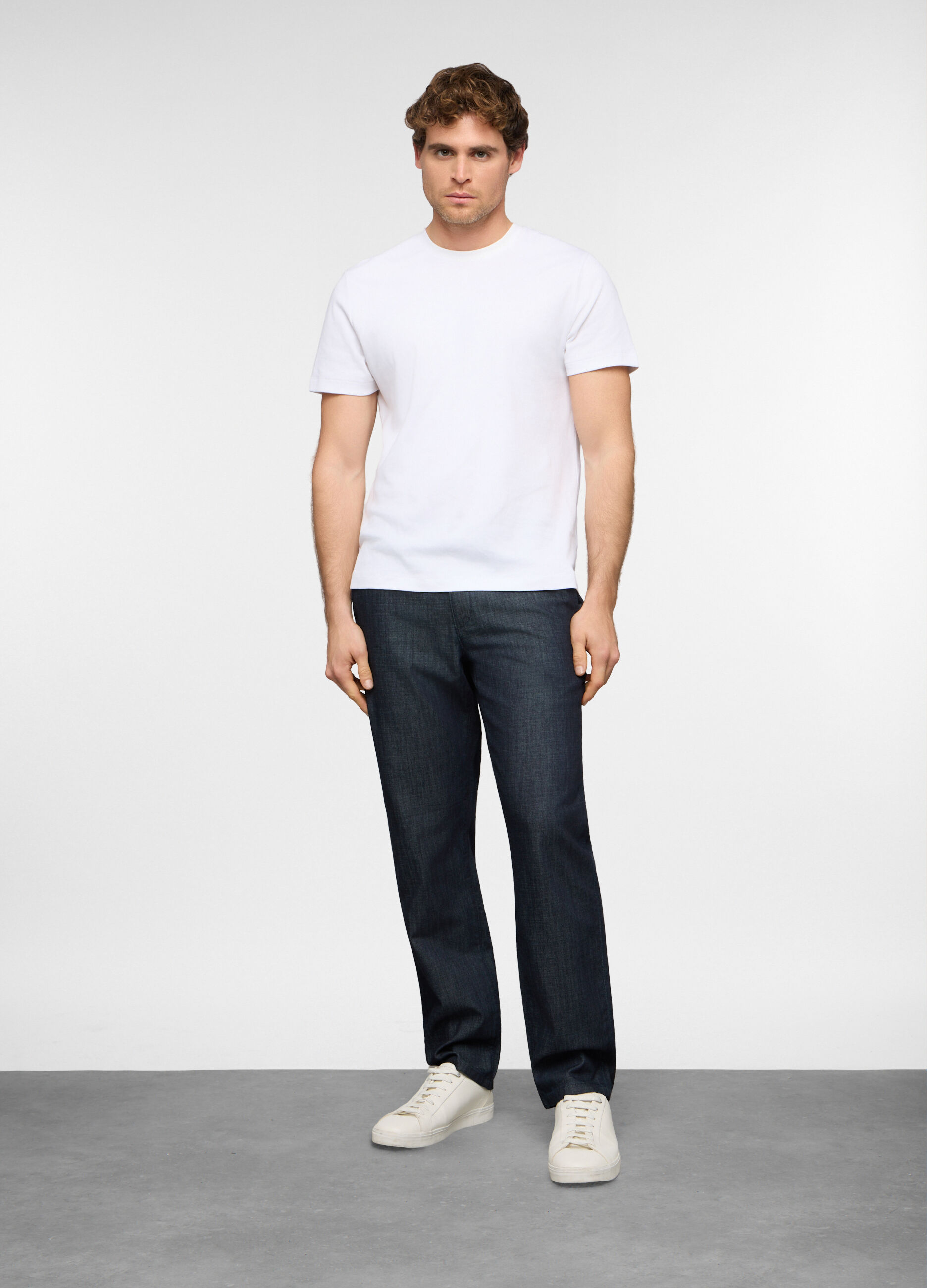 Jeans slim fit in denim di cotone e viscosa uomo_0