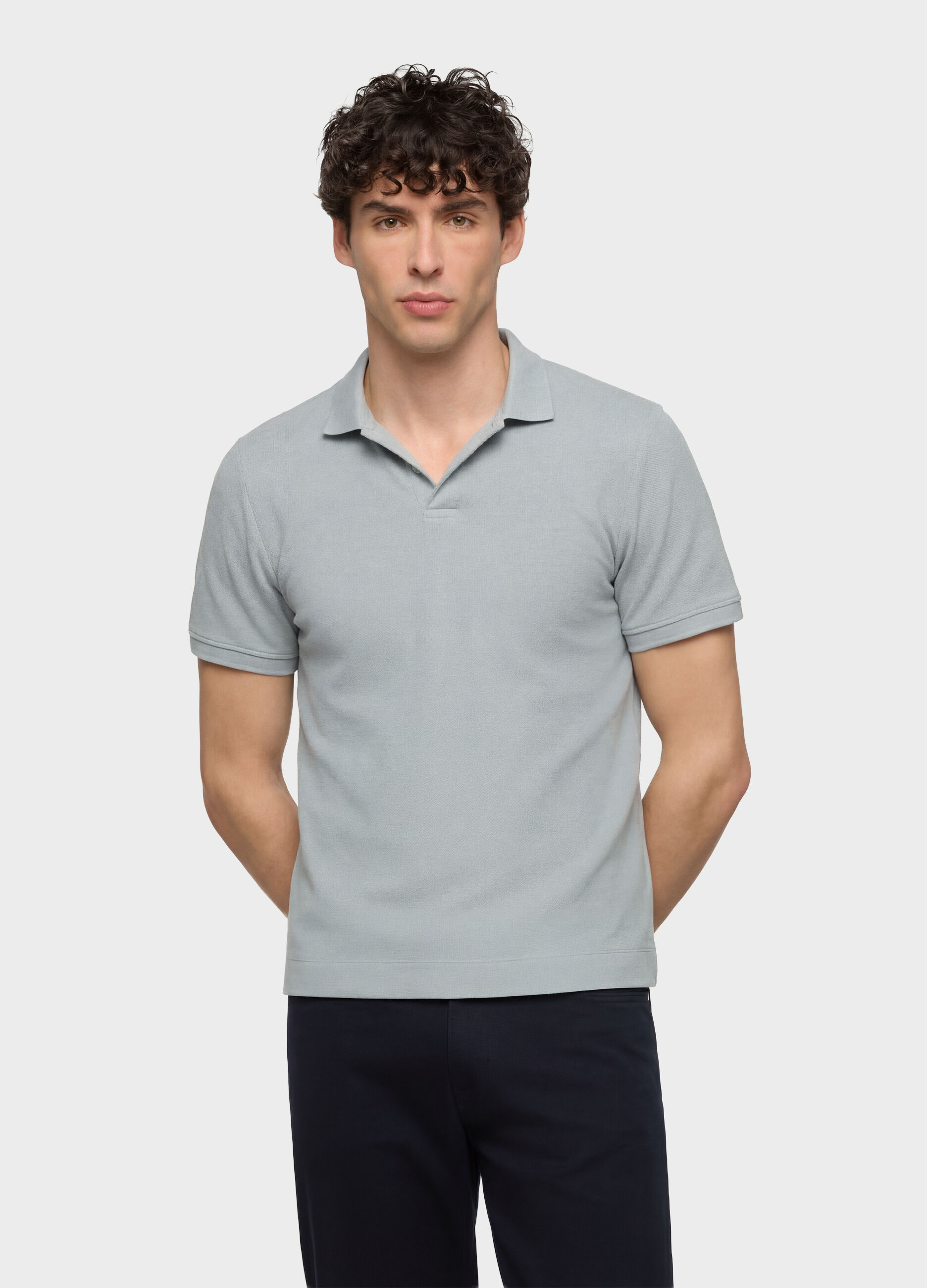 Polo a maniche corte in cotone con allacciatura seminascosta uomo_0