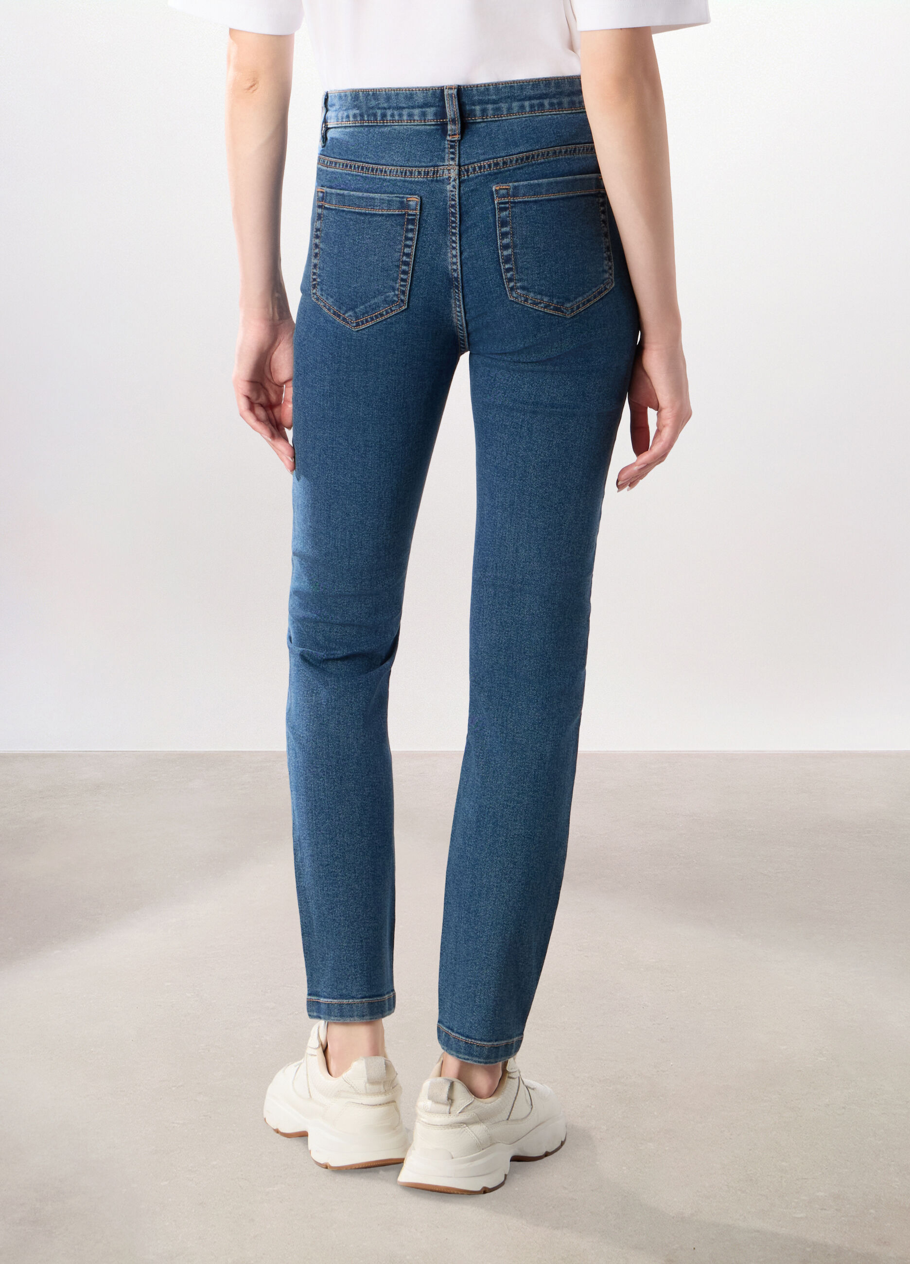 Pantaloni in denim misto cotone donna_1