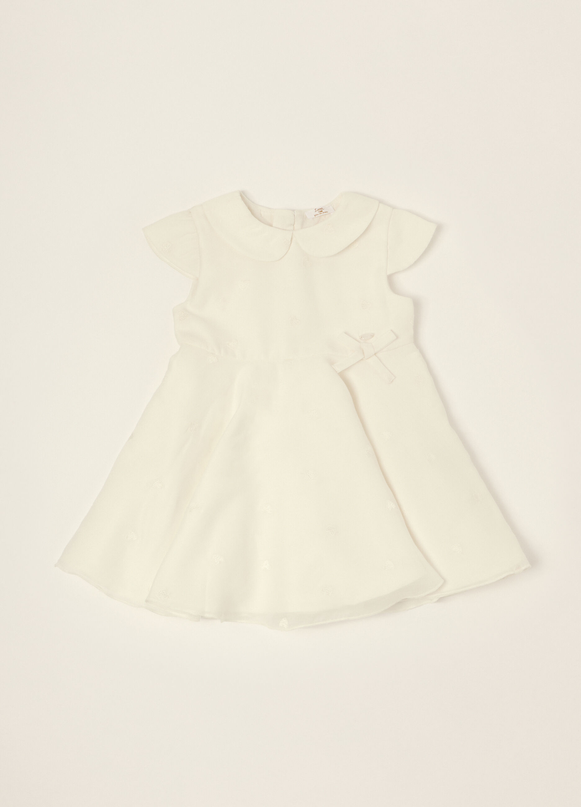 Abito bianco con dettagli ricamati_0