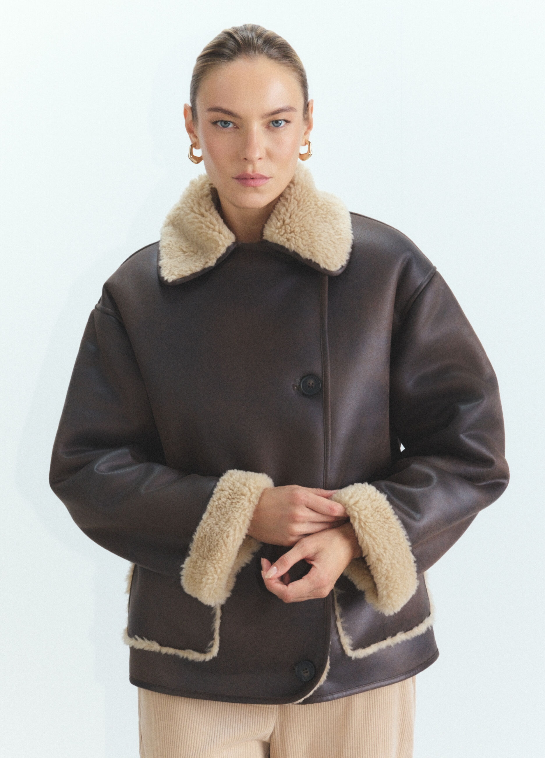 Eco montone con scollo reverse donna_1