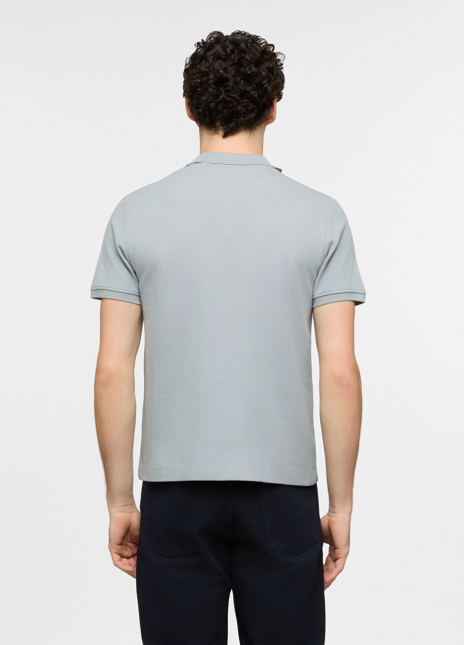 Polo a maniche corte in cotone con allacciatura seminascosta uomo_1