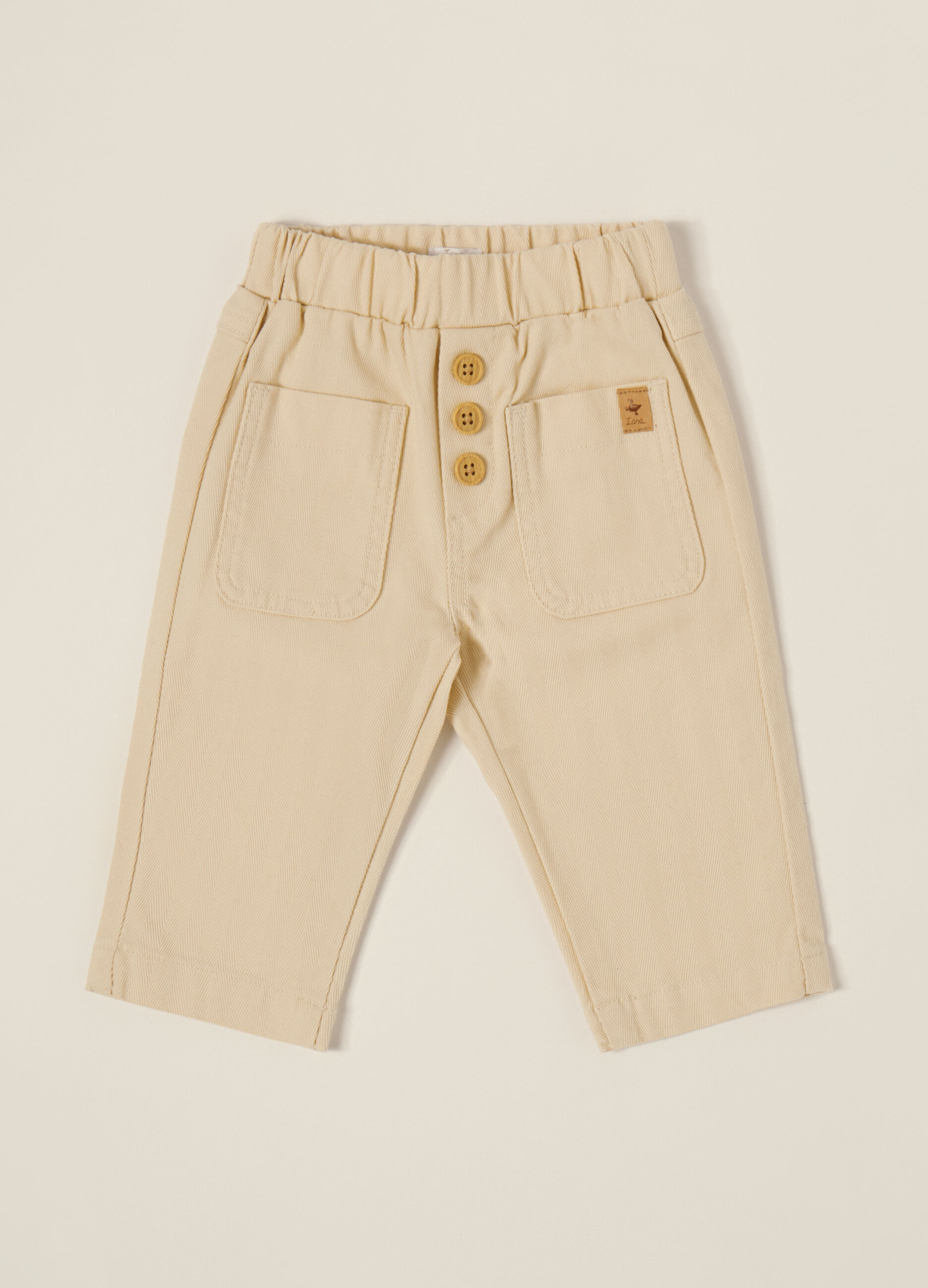 Pantaloni beige elasticizzati per neonato_0