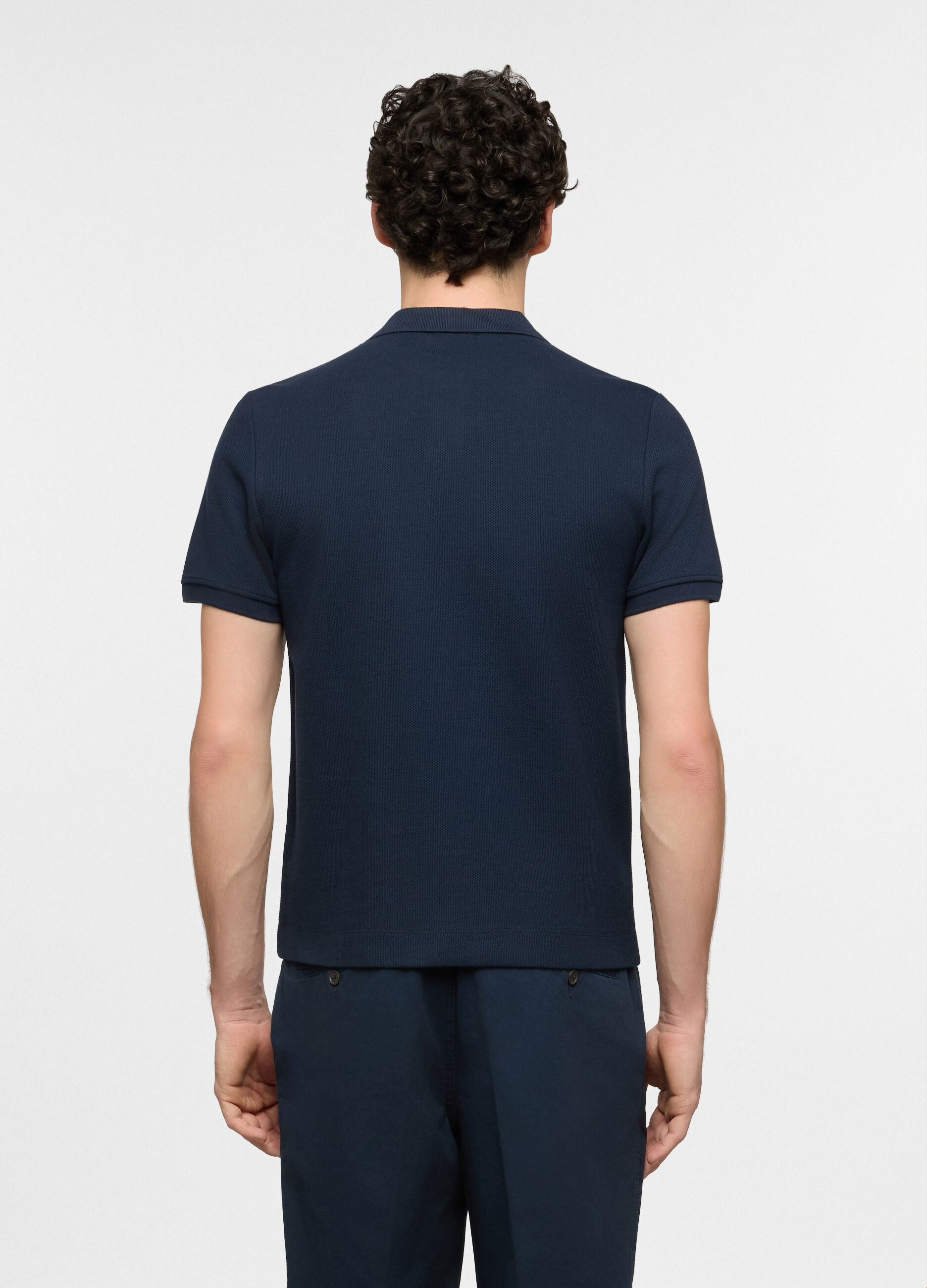 Polo a maniche corte in cotone con allacciatura seminascosta uomo_1