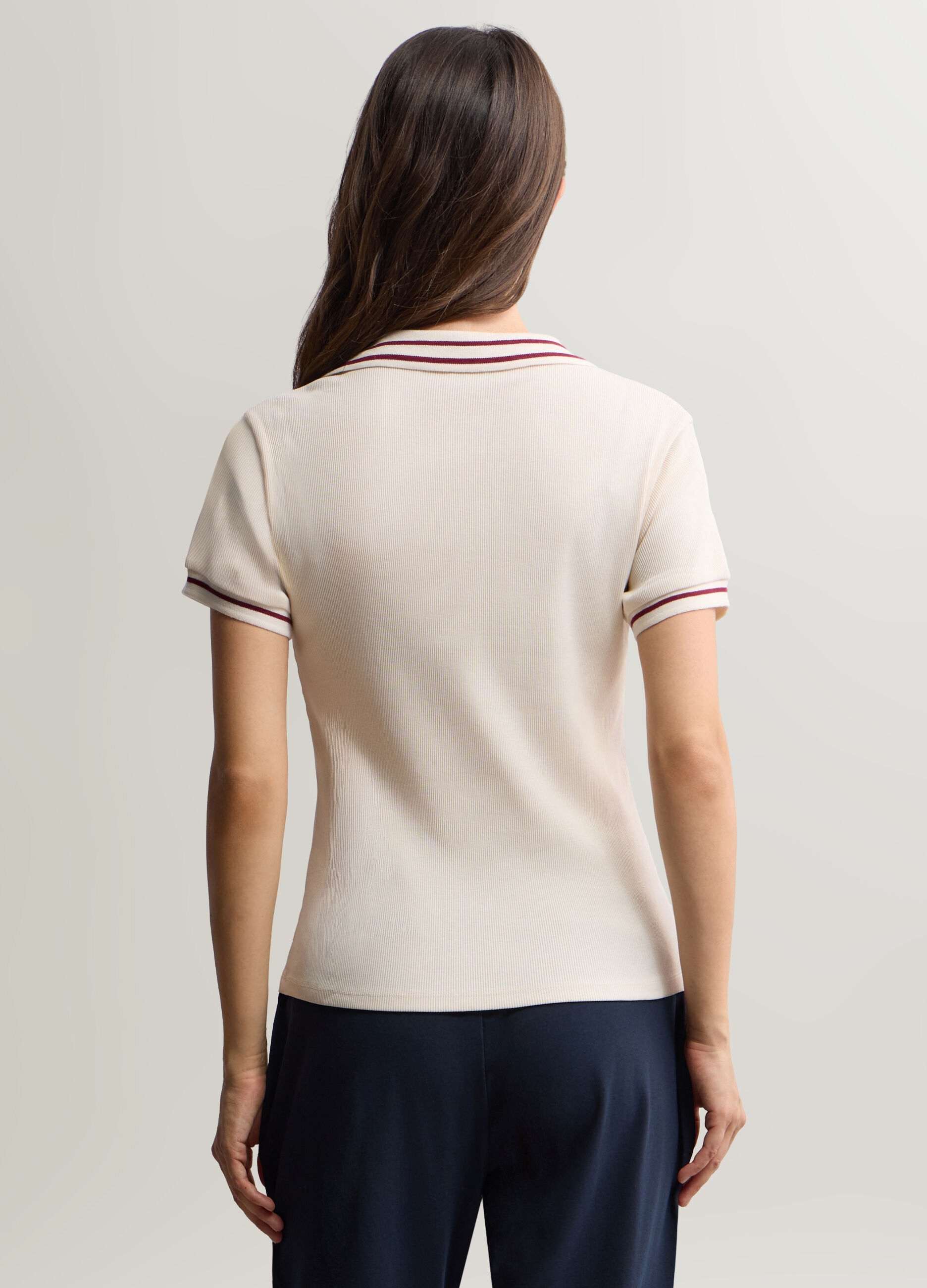 Polo con scollo a V in costina donna