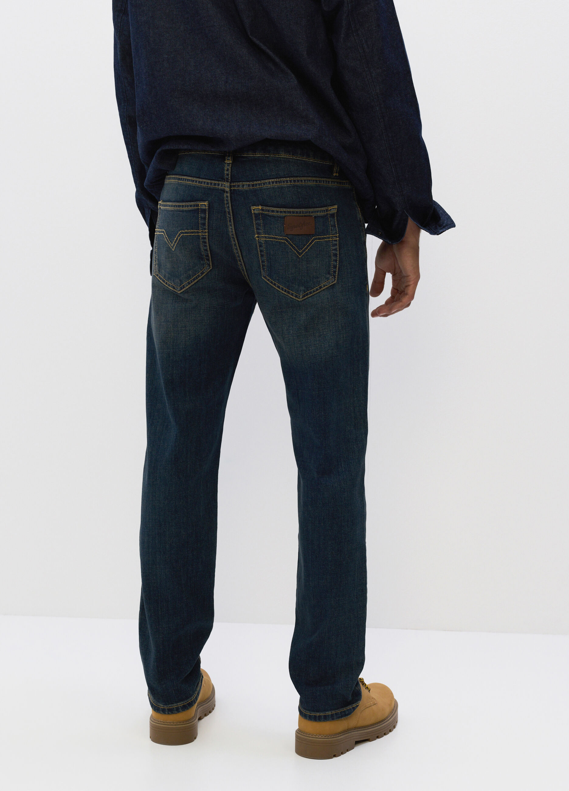Jeans slim fit in denim lavato uomo_1
