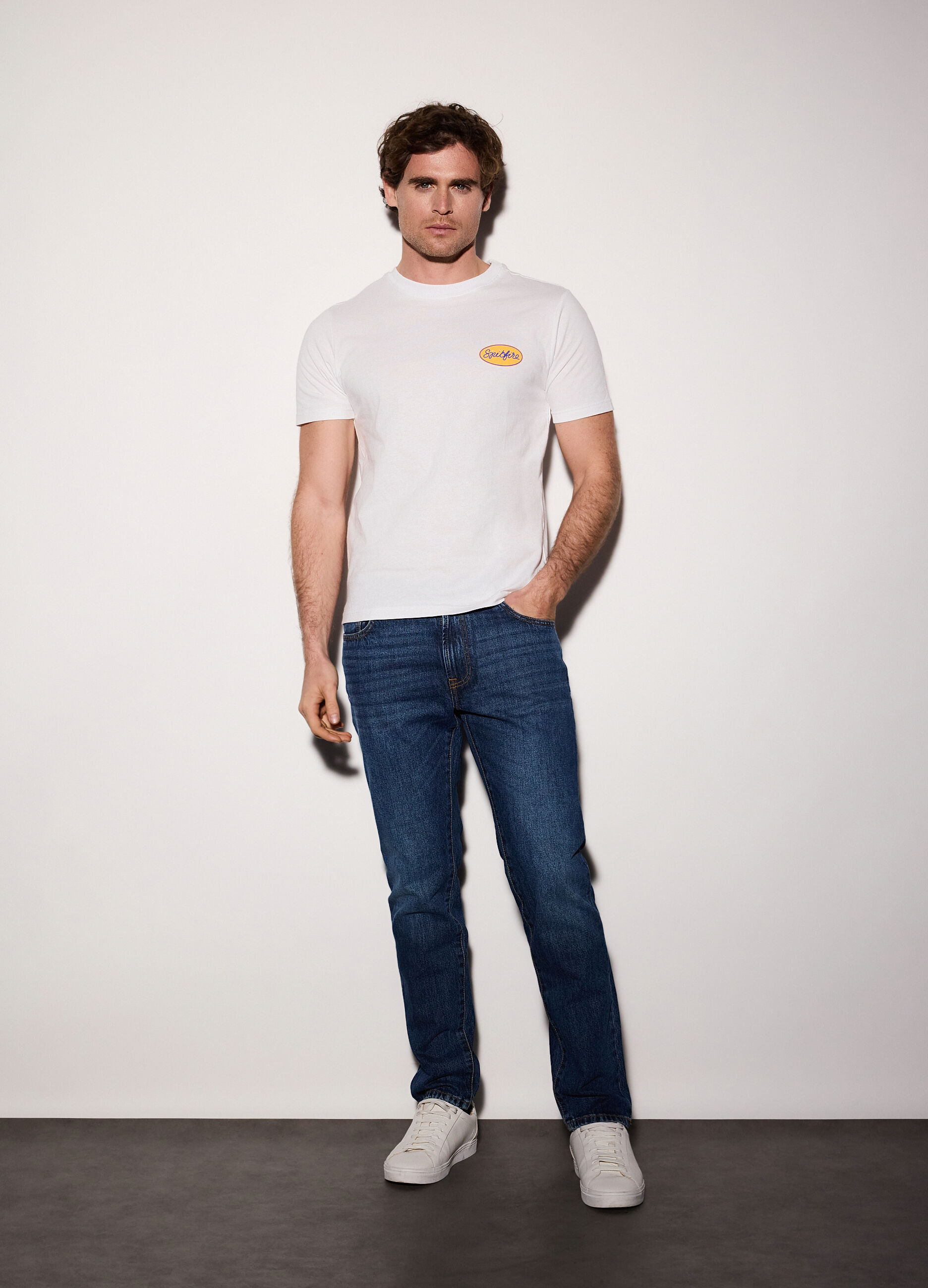 Jeans slim fit in denim di cotone elasticizzato uomo_0