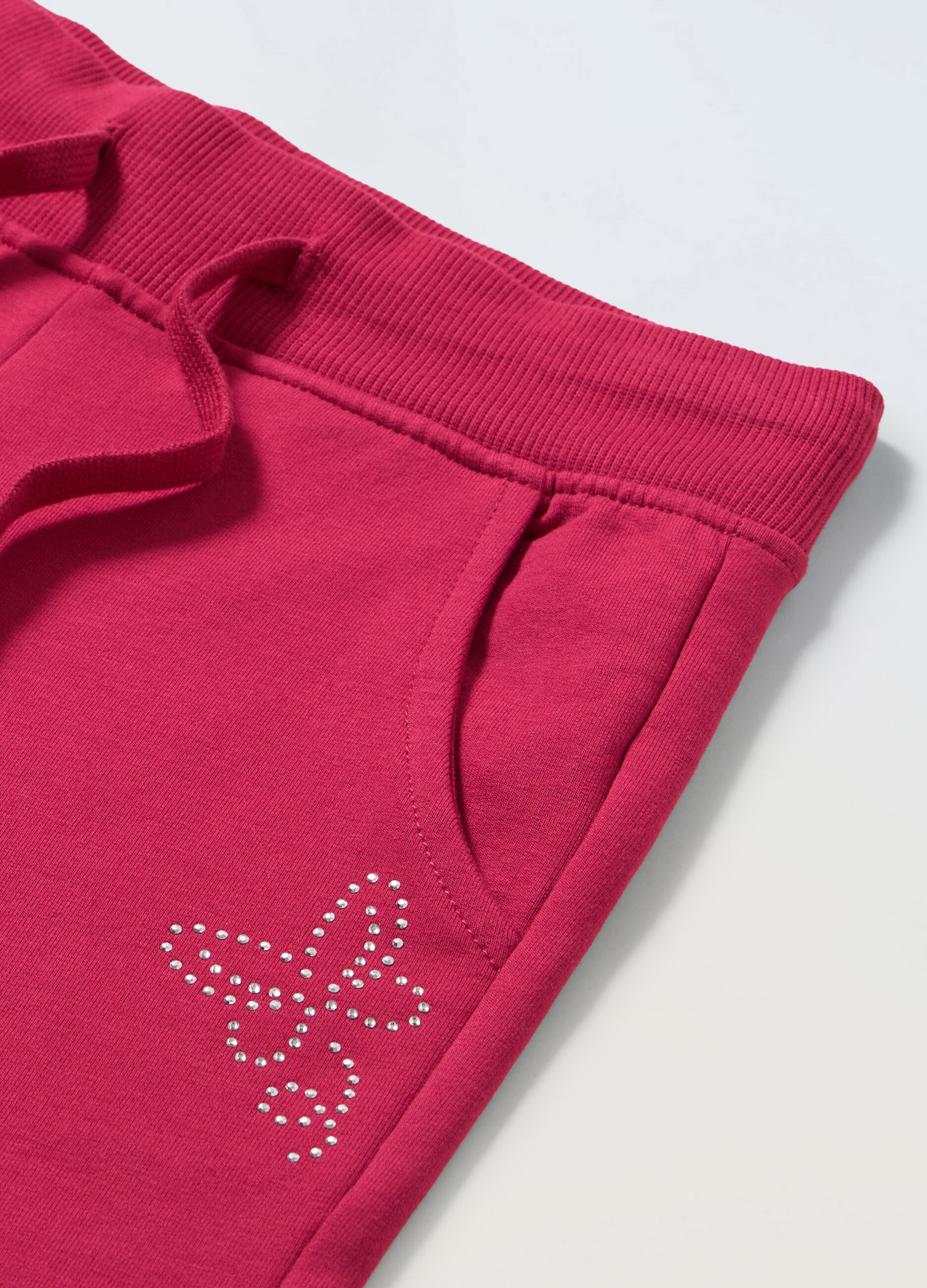 Joggers in french terry stretch con strass bambina_1