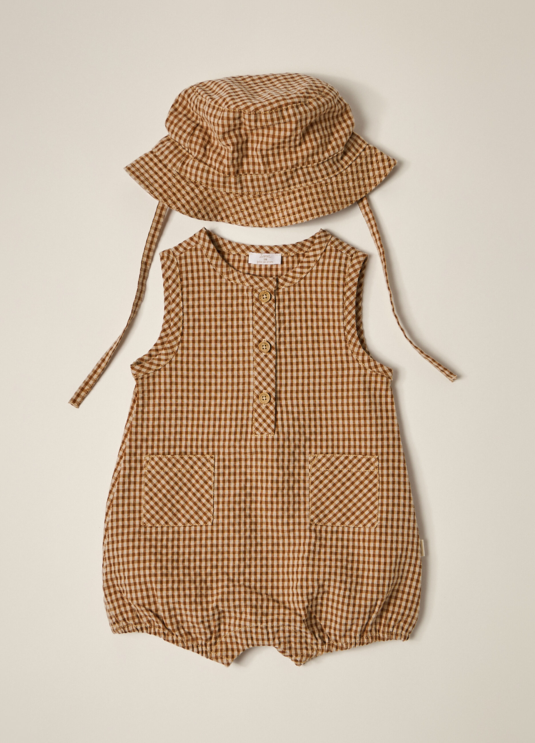 Set cappello e pagliaccetto a quadri neonato_1